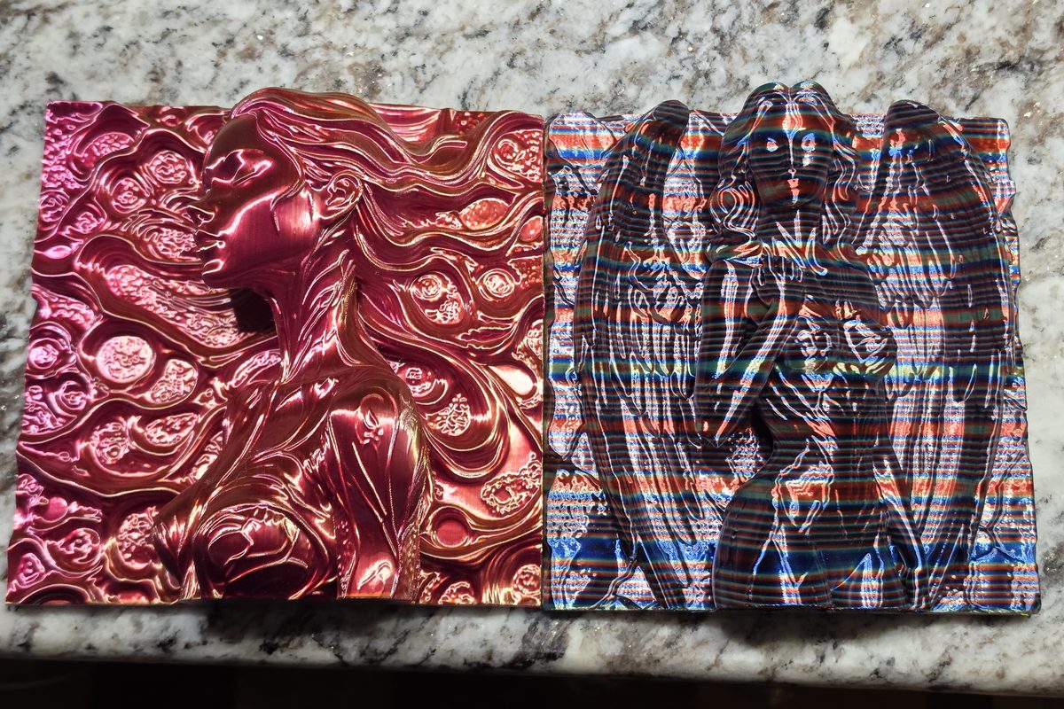 Two 3D printed filament-painting relief panels — a flowing red silk portrait of a woman and a multicolor angel